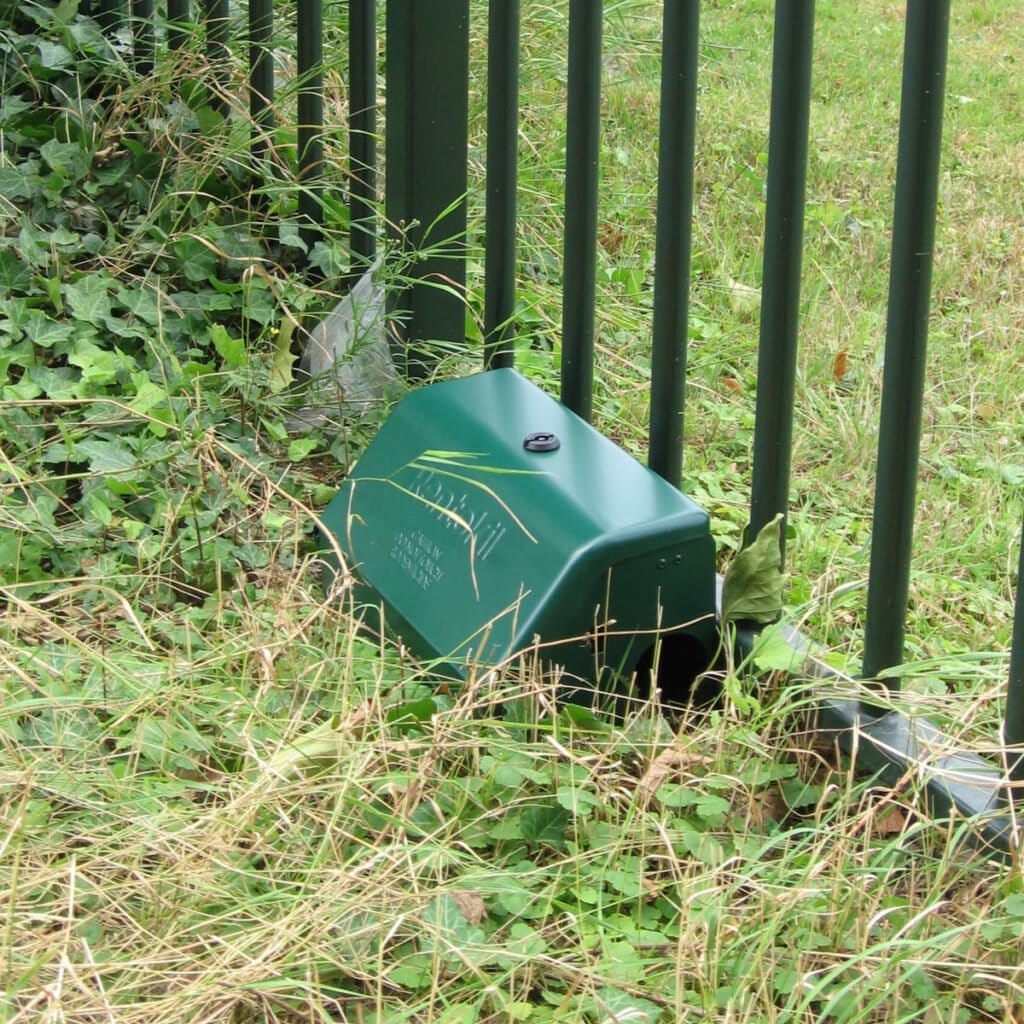 Rentokil mouse trap, installed in a garden near house fence